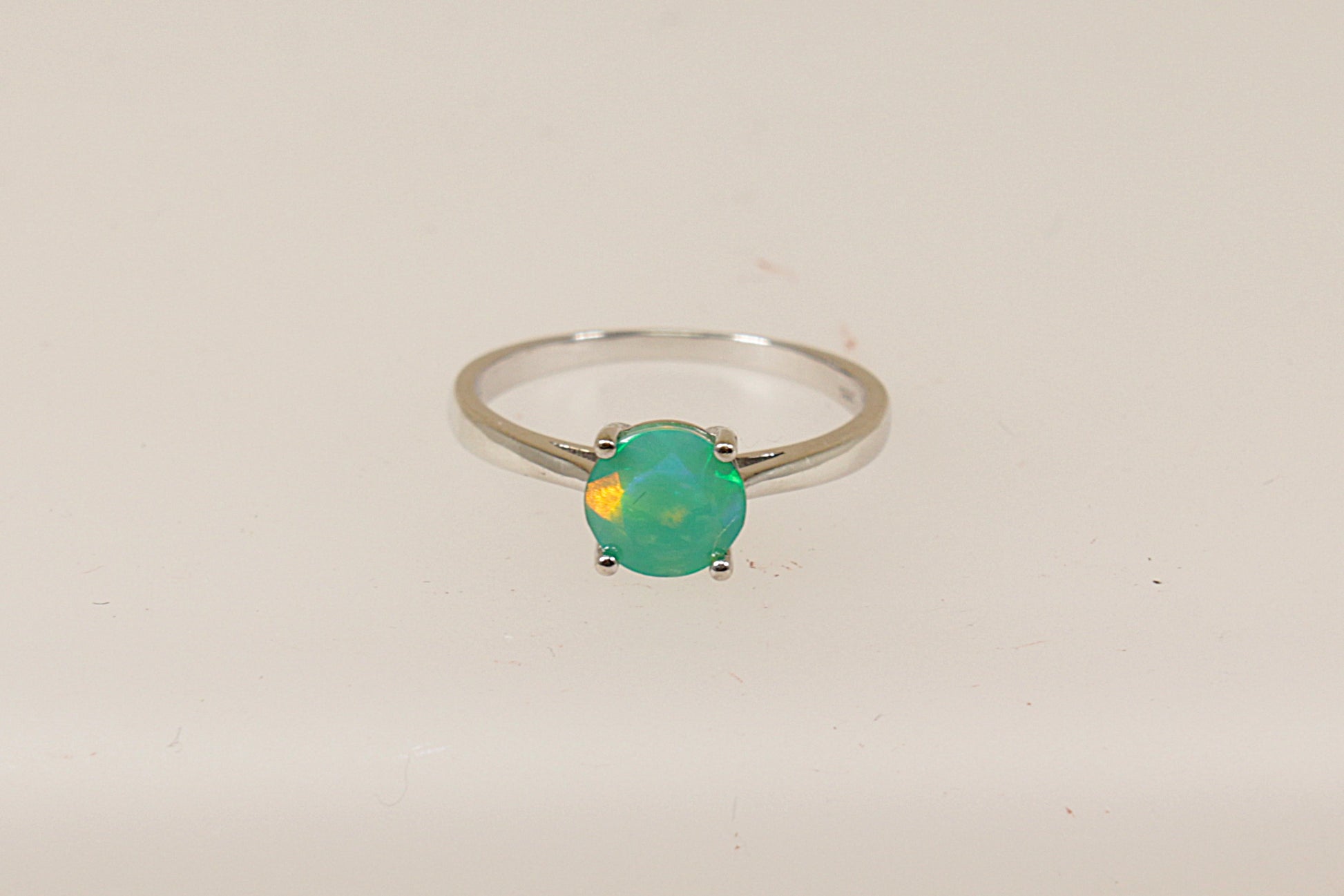 A sterling silver pre-owned green mystic crystal solitaire ring, UK finger size O, only nineteen pounds sterling.