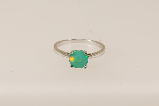 A sterling silver pre-owned green mystic crystal solitaire ring, UK finger size O, only nineteen pounds sterling.