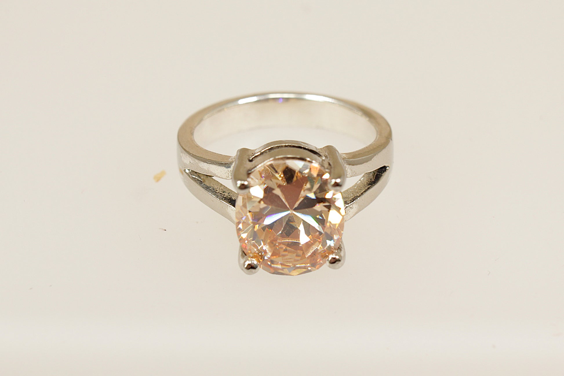 A Sterling Silver Citrine Coloured Crystal Solitaire Statement Ring stamped 925 for sterling silver, UK finger size Q. 