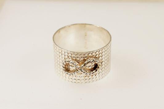 A silver band ring with an engine-turned pattern and embossed rope design, Wear as a finger or thumb ring, Suitable for any gender, It is in excellent condition and stamped 925 for sterling silver. UK Finger size Z.