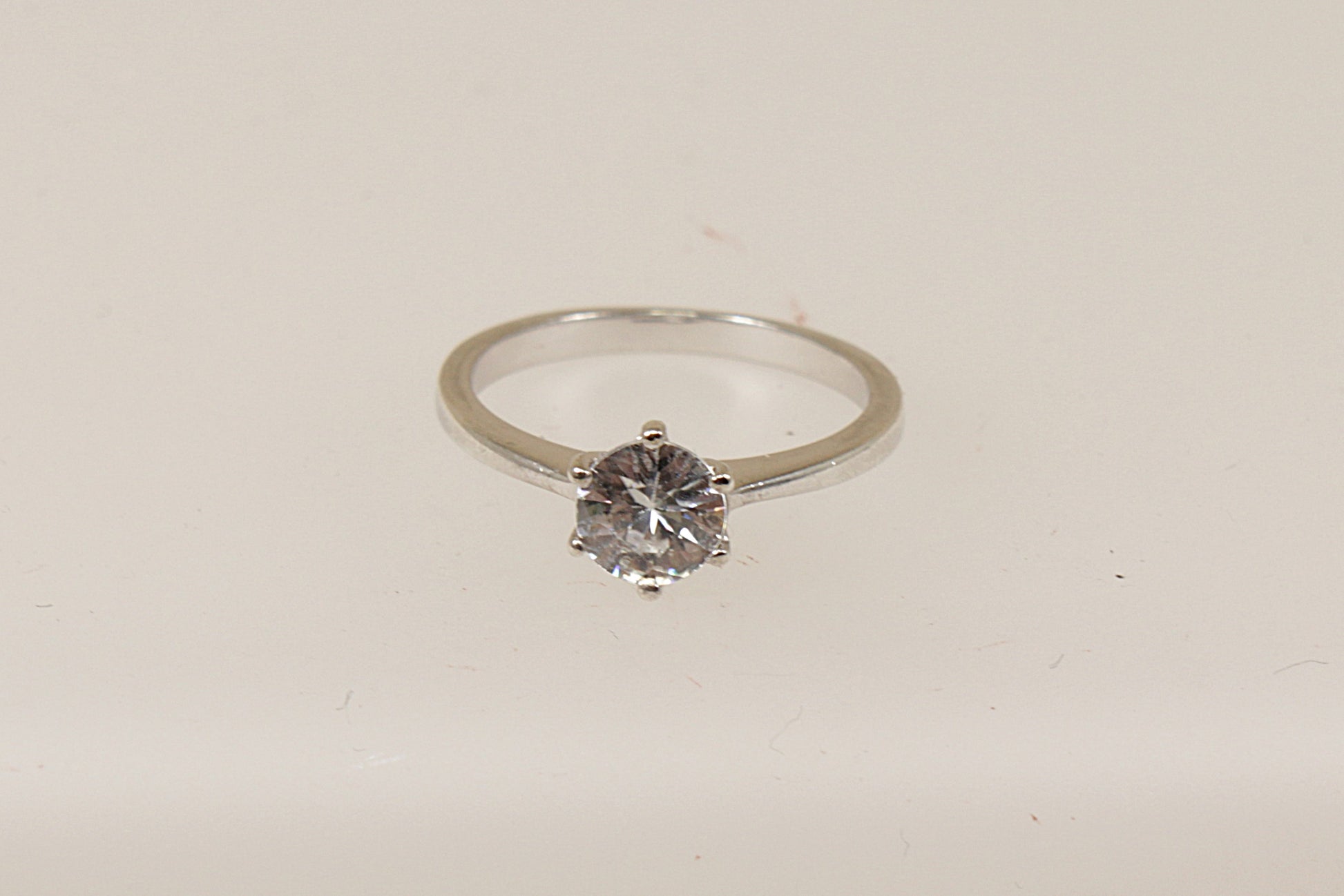 A sterling silver white topaz solitaire ring, Stamped 925 for sterling silver and the makers mark ‘TGGC’ for The Genuine Gemstone Company, UK finger size O.