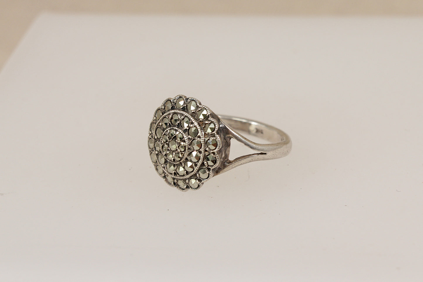 Silver art deco marcasite  ring with intricate design on a light background