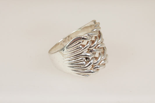 Silver gents keeper ring with a textured design on a light beige background